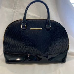 Black patent leather handbag